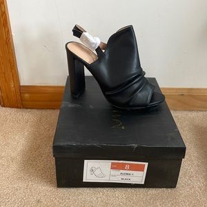 Black, open toe, sling back 4 in heel